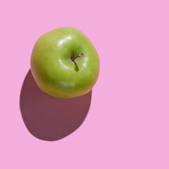 Fresh Green Apple isolated on pink background
