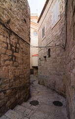 Jerusalem Old City narrow street and ancient church