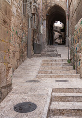 Fototapeta na wymiar Jerusalem Old City narrow ancient streets with arches