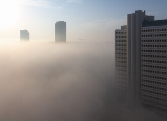Heavy fog in Tel Aviv. View above. The city over the clouds