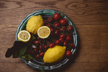 plate with lemon and tomatos