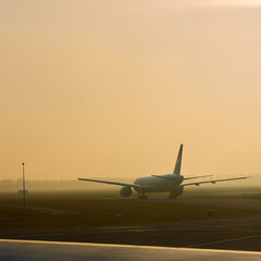 Fototapeta na wymiar The takeoff plane in airport early morning