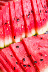 Fresh thin slices of watermelon in close-up.