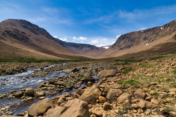 Rocky creek flowing down from mountains - Tablelands, Gros Morne, Newfoundland, Canada