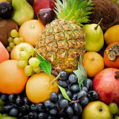 Various assorted juicy fruits. Fresh fruits colorful background.