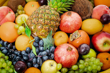 Naklejka na ściany i meble Assortment of colorful ripe tropical fruits. Top view