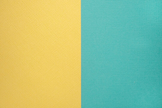 Two colored papers with a blue and yellow overlay on the floor. they divide half of the image. Dual background, flat lay. High quality photo