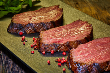 Sous-vide steak cut into pieces, cooked to eat beef on the stone table