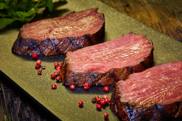 Sous-vide steak cut into pieces, cooked to eat beef on the stone table