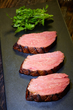 Sous-vide steak cut into pieces, cooked to eat beef on the stone table