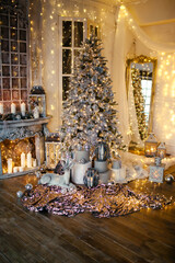 warm and cozy evening in Christmas room interior design,Xmas tree decorated by lights presents gifts,toys, deer,candles, lanterns, garland lighting indoors fireplace.holiday living room.magic New year