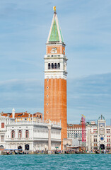 Fototapeta premium Full size view of Campanile Bell Tower at San Marco square in Venice, Italy, at sunny day and deep blue sky.