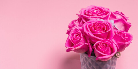Bouquet of fresh pink roses in a bucket