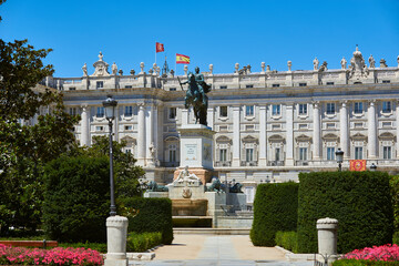 Fototapeta premium Plaza de Oriente Square. Madrid, Spain. East facade of Royal Palace of Madrid (Palacio Real) with Monument to Felipe IV in foreground.