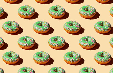 Pattern of donuts on yellow background
