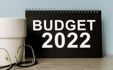BUDGET 2022. office accessories on the table . business concept.
