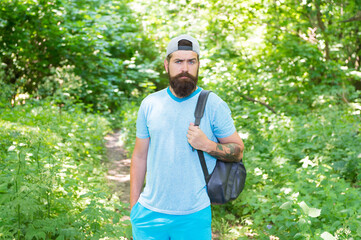 Naklejka na ściany i meble mature hipster with beard in forest. summer male fashion. summer rest and activity.