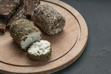 tasting soft white cheese sliced on a wooden board for cutting