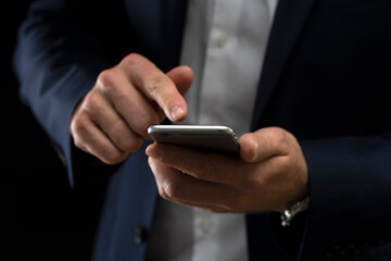 Close up of a man using mobile smart phone