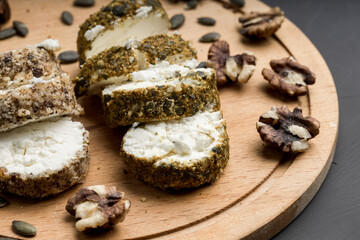 soft homemade breakfast cheese sliced on a cutting board
