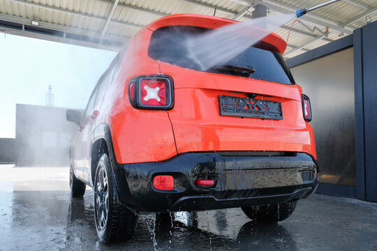 Car wash with high pressure water. Car in foam, Car wash