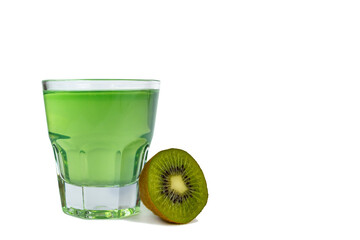 Sweet dessert, kiwi jelly in glass glasses and next to fresh kiwi, cut in half, isolate
