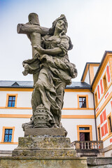 Fototapeta na wymiar Kuks, Czech republic - May 15, 2021. Statue of virtue - symbol of Faith