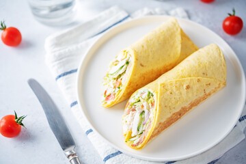 Corn tortilla with chicken and vegetables in a plate