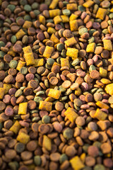 Dry food for cats and dogs close - up-a background of round pellets and pillows with a soft filling-pate. Healthy pet food, copyspace