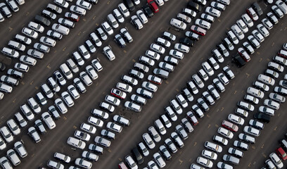 Many cars at factory parking