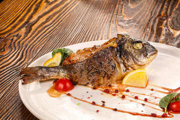 Stuffed dorada fish vith vegetables