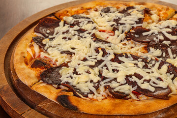 Pizza with dry beef and cheese