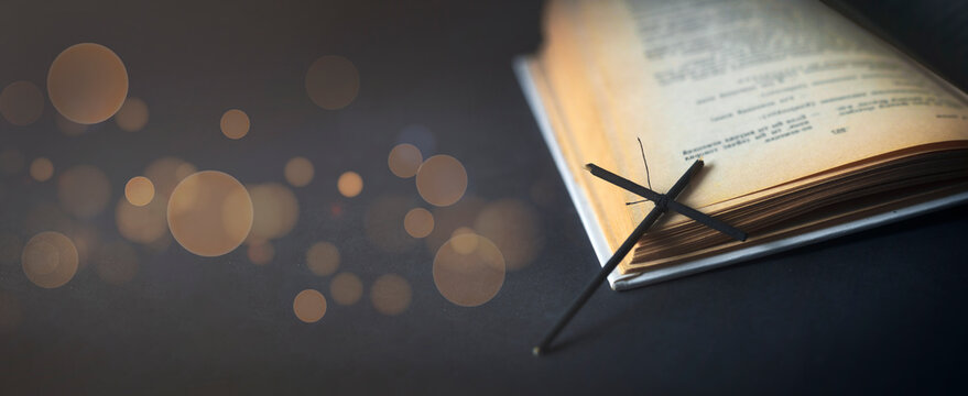 Open bible and cross. An open book. Copy space.	
