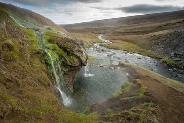 Laugavallalaug Hot Pot with small Waterfall in Iceland 