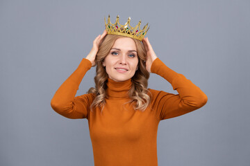 smiling blonde girl with curly hair wear crown, egoism