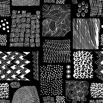 Abstract seamless pattern with different hand drawn white ornaments on  black background.