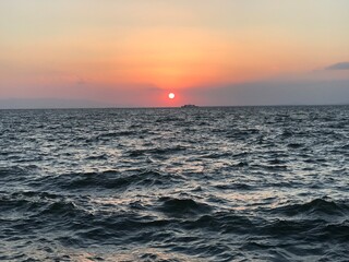 Fototapeta premium sunset and the ferry crossing the bay