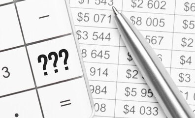 Business and finance. On the table is a report, a pen and a calculator, on the big key of which is written - question symbol