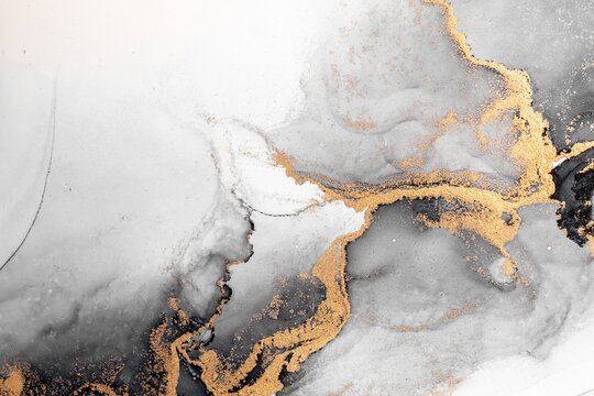 Black gold abstract background of marble liquid ink art painting on paper . Image of original artwork watercolor alcohol ink paint on high quality paper texture . © Blue Planet Studio