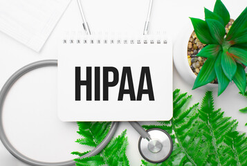 hipaa word on notebook,stethoscope and green plant