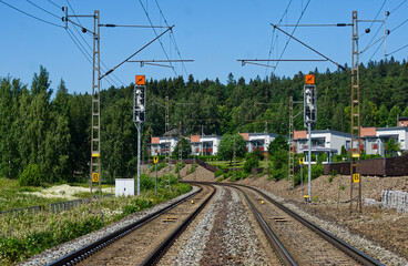 Curved railroad photographed from an automatic grade crossing area