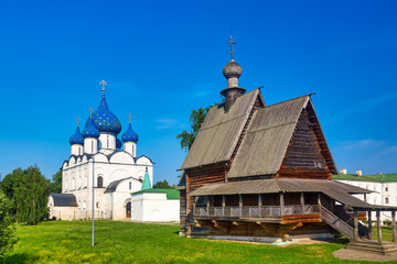Fototapeta na wymiar Wooden Church of St. Nicholas near Kremlin in Suzdal, Russia. Summer sunny day