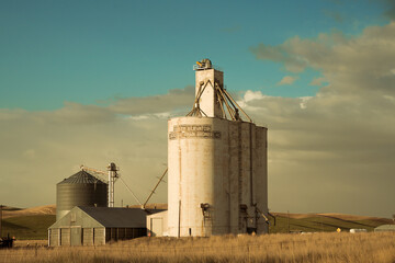 View of industrial grain elevator seen from wheat farm in the Palouse Washington state