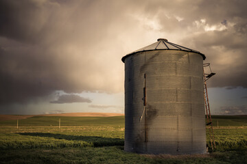 View of industrial grain silo from wheat farm in the Palouse Washington State