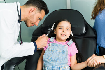Child getting checked for an ear infection