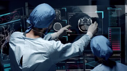 Professional doctors analyzing patient's medical MRI diagnosis by checking on a large glass screen with futuristic holograms. Concept of: medicine, doctors, future, holographic, brain scan - Powered by Adobe