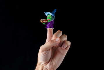 Scary baby finger puppets made of papier mache on hand isolated