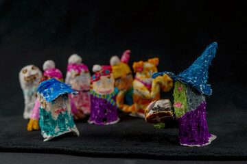 Scary baby finger puppets made of papier mache on hand isolated