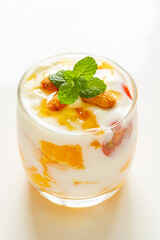 Mango and cherry tomato yogurt close up.
