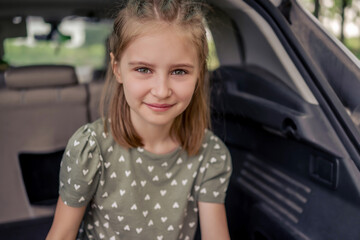 Preteen girl with car at the nature